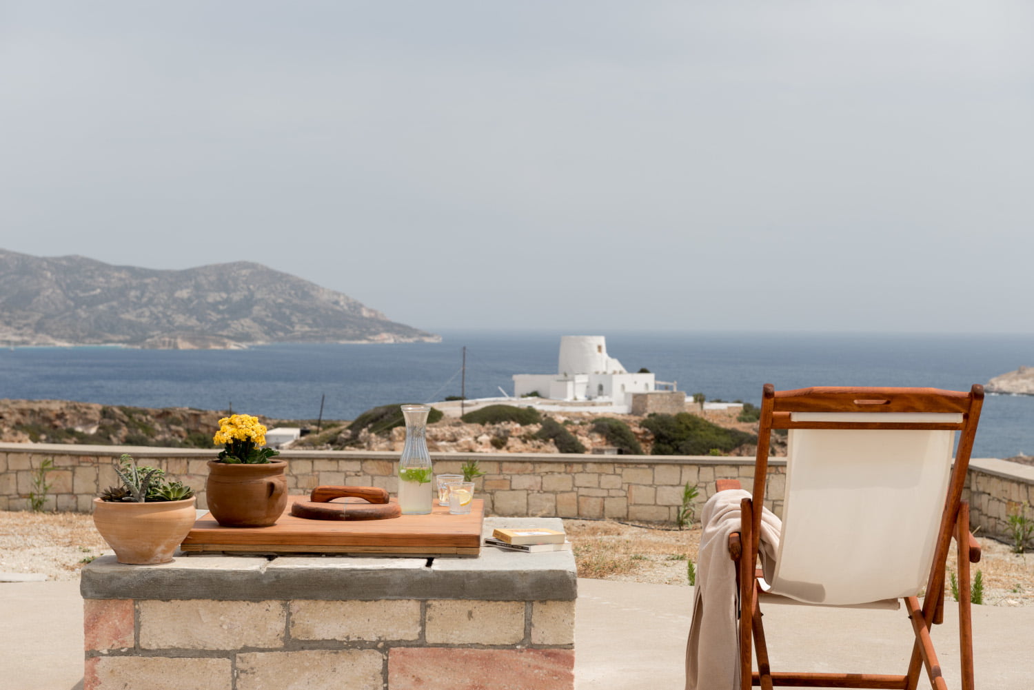 Outdoor lounge area on the terrace at Casa Nefeli a vacation home in Kimolos Cyclades Greece by RentAGreekHome powere by PathTravelDesigns
