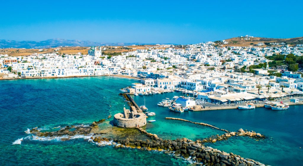 Ancient ruins of Venetian castle in the harbor of Naoussa town, Destination Paros in the Cyclades featuring the cosmopolitan village of Naoussa and the ruins of the Venetian Castle in the Old Harbour by RentAGreekHome powered by PathTravelDesigns Greece